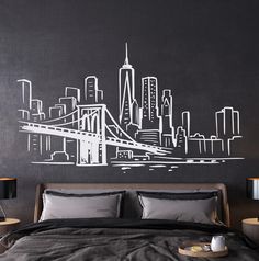 a bedroom with a city skyline drawn on the wall