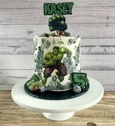 a hulk cake with the number five on top and an image of thor's head