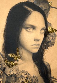 a woman with butterflies on her head and flowers in her hair, looking at the camera