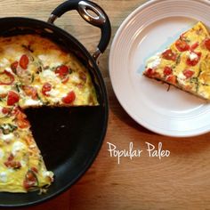 a pan with a slice of pizza on top of it next to a white plate