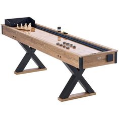 a wooden table with an x leg base and foosball board on the top