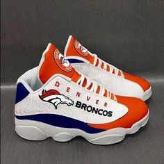 an orange and white denver football shoe