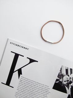 an open magazine with a ring on top of it