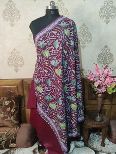 Indian Spring Shawl, Kashmiri Shawl, Kashmiri Wrap An exquisite Kashmiri Shawl With All Over Chinar-Floral Embroidery, This Kashmiri Shawl Is Customisable as per the colour and size of your Preference   Embroidery              Floral Aari Work Length / Breadth     200cm / 100 cms ( Customisable)  Fabric                     Pure Wool Colour                     Maroon ( Customisable)  Returnable          Yes Free Shipping            Yes * If you want this shawl in any other base colour, Please dro Embroidered Red Pashmina Shawl In Jamawar, Traditional Multicolor Embroidered Jamawar Pashmina Shawl, Traditional Jamawar Pashmina Shawl With Multicolor Embroidery, Ceremonial Embroidered Jamawar Shawl, Festive Pashmina Traditional Wear With Motifs, Red Pashmina Dupatta With Resham Embroidery, Traditional Pashmina Dupatta For Ceremonial Use, Traditional Red Dupatta With Handwork, Traditional Pashmina Dupatta For Ceremonial Occasions