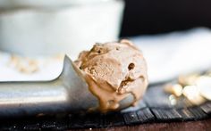 a scoop of chocolate ice cream sitting on top of a table