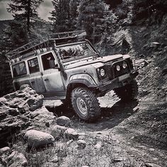 an off road vehicle driving on a rocky trail