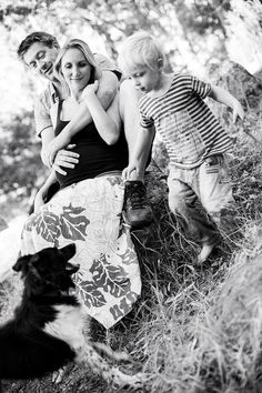 black and white photograph of family with dog