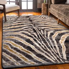 Made in the USA. 100% EnduraStran nylon construction for easy care and durability. Synthetic Loc-Bak backing ensures this rug lays flat and won’t curl. Use of a rug pad is recommended to prevent slippage and movement. 3-ft x 4-ft size is a perfect accent piece for foyers and next to beds. Heat resistant fiber is safe to use in any area of your home. Spot cleans easily with mild detergent/ vacuum regularly to keep it looking like new. Moisture-wicking nylon material resists pet dander and bacteria. 1-year warranty gives you peace of mind. American Dakota 3 X 4 (ft) Rawhide Indoor Animal Print Area Rug in Brown/Tan | 0644RWH234 Zebra Area Rug, Golden Zebra, Zebra Print Rug, Zebra Rug, Decor Western, Luxury Floor, Zebra Design, Area Rug Runners, Custom Made Furniture