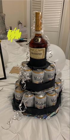 there is a cake made to look like a bottle of liquor on top of it