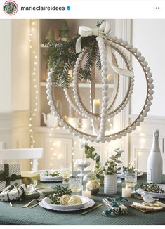 a table topped with plates and christmas decorations