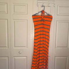 * Never Worn * Orange And Gray Striped Dress Great For Beach And Cruise! * Padded Cups And Strap To Tie Behind Neck * Top Of Bodice To Bottom Of Dress Is 52 Inches * Across The Bodice Laying Flat Is 16 Inches * 60% Polyester/35% Rayon/5% Spandex * Machine Wash With Like Colors Orange Halter Neck Maxi Dress For Spring, Orange Sleeveless Maxi Dress For Day Out, Sleeveless Orange Maxi Dress For Day Out, Orange Casual Halter Neck Dress, Casual Orange Halter Neck Dress, Spring Orange Halter Neck Sundress, Orange Fitted Sundress For Beach, Orange Halter Neck Sundress For Spring, Fitted Orange Sundress For Beach