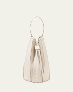 Altuzarra "Drum" bucket bag in canvas cotton and leather     Top handle     Detachable, adjustable crossbody strap    Can be worn as a top handle or crossbody bag     Drawstring closure     Approx. 7.3"H x 9.3"W x 7.3"D    Made in Spain White Bucket Bag For Evening, Spring Bucket Bag With Handles, Spring Everyday Bucket Bag With Handles, Luxury Crossbody Bucket Bag For Errands, Cream Bucket Satchel, Luxury Bucket Shape Hobo Bag For Errands, Luxury Bucket Hobo Bag For Errands, Modern Bucket Satchel For Errands, Spring Evening Bucket Bag Tote