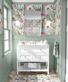 a bathroom with green walls and floral wallpaper on the walls, along with a white vanity