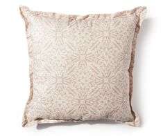 a pink and white pillow on a white background with an intricate pattern in the middle