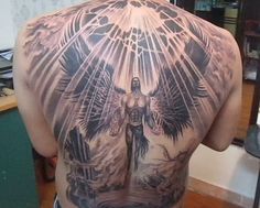 the back of a man with an angel tattoo