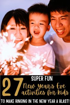 two children and an adult are smiling with fireworks in the background