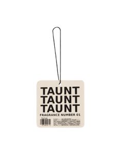 a tag with the words taunt taunt on it, hanging from a string