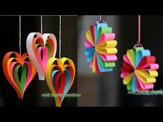 three different types of paper hearts hanging from strings with the words, origami heart creations