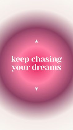 the words keep chasing your dreams in white on a pink circle with stars around it