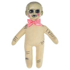 a creepy doll with pink bow tie and eyes