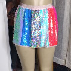 Okay So For For Those Of You Who Love To Wear Sequins And Mini Skirts And Like To Sparkle As I Do Myself This Is A Hot Skirt Perfect For You The Colors Are Beautiful It's Slightly Short But Hot So If Your Into The Sequin Thing You're Going To Love This Skirt It Is Hot I Am Not Seeing A Size Or A Brand On A Tag But I Would Definitely Say It's A Small And It's Just Hot That's What I Call This Skirt It's Hot Brand New Without Tag Never Worn Pink Mini Skirt For Spring Festival, Fun Spring Party Bottoms, Pink Mini Skirt For Festival, Fitted Multicolor Party Shorts, Pink Sequined Mini Bottoms, Pink Sequin Mini Skirt For Summer, Pink Sequined Mini-length Bottoms, Multicolor Mini Skirt For Spring Night Out, Summer Pink Mini Skirt With Sequins