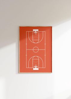 an orange basketball court is hanging on the wall