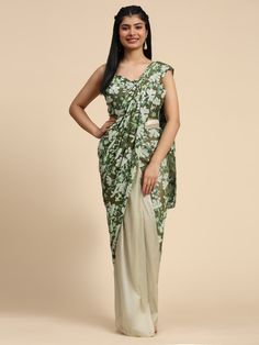 This stunning pre-stitched half saree features a green color net and satin fabric adorned with floral sequin work, making it perfect for parties, festivals, and receptions.
The saree comes with a matching green net blouse also embellished with floral sequin work, creating a cohesive and elegant look.
With a ready-to-wear saree length of 5.50 meters and a fully stitched blouse in S to M size, this designer ensemble offers effortless elegance and convenience. Net Blouses, Bollywood Lehenga, Cocktail Wear