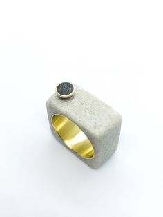 This listing is for a black and white cement and resin ring on brass. The ring consists of mostly white cement with an inlay of black cement and charcoal in a brass accent, Set over a brass ring. The ring is approximately a size 8, but can fit 7.5-8. All items are hand made and unique.  *PLEASE READ* After continuous wear, brass jewelry can develop a black residue (oxidation). This is very easily fixed by soaking your jewelry in lemon juice for no more than fifteen seconds, then rinsing it in wa Concrete Minimalist, Concrete Ring, Unique Promise Rings, Concrete Jewelry, White Cement, Black Cement, Freshwater Pearl Ring, Contemporary Ring, White Concrete