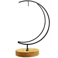 a wooden and metal sculpture on a white background