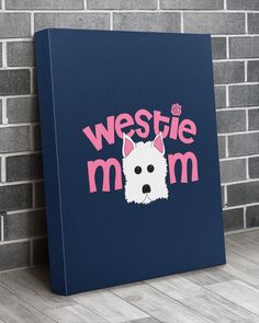 a blue canvas with the words westie mom and a white dog's head