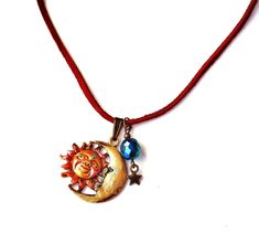 "Add Celestial style to your outfits with this artful necklace featuring a large sun & moon pendant that's been accented with colorful painted touches! Dangling alongside, a faceted deep turquoise glass bead sits above a little star charm to add some whimsical movement! And the sun sports a little Swarovski crystal rhinestone in her \"third eye\"! The sienna brown leather necklace is adjustable, too, with an extender chain, so you can change your length when you feel like it! A super-cute pi Adjustable Sun Design Necklace For Festivals, Bohemian Sun, Black Velvet Choker Necklace, Boho Celestial, Brown Leather Necklace, Deep Turquoise, Leather Cord Necklace, Black Velvet Choker, Leather Corded Necklace