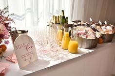 a table topped with lots of glasses filled with drinks