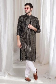 Black kurta with striped sequin work embroidery. Paired with solid churidaar. - Aza Fashions Party Wear Straight Kurta With Mirror Work, Embroidered Straight Kurta For Party, Party Wear Embroidered Straight Kurta, Eid Party Wear Straight Kurta, Festive Party Wear Straight Kurta, Festive Party Wear Kurta With Sequins, Embroidered Party Wear Kurta For Festive Occasions, Party Wear Kurta With Zari Work For Diwali, Diwali Party Wear Kurta With Traditional Drape