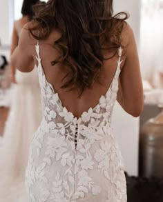 the back of a woman's wedding dress