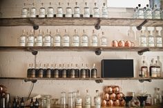 many bottles and jars are on the shelves