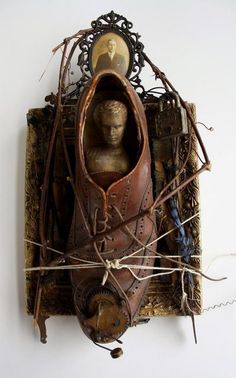 an old leather shoe with a face in the middle and some wires attached to it