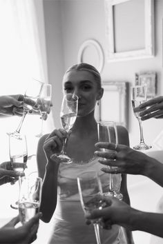 a group of people holding wine glasses in their hands