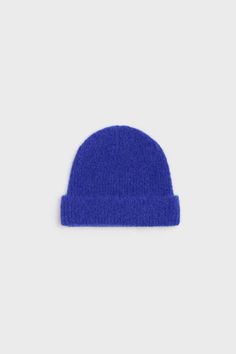 The embrace beanie is knit from a soft alpaca blend to a snug yet flexible design. it is detailed with logo embroidery and presented in a shade of blue that easily matches with outerwear.    - logo embroidery    washing instructions  gentle hand wash    fabric content  alpaca 57% wool certified 25% nylon 18% Blue Soft Knit Hat For Fall, Blue Soft Knit Beanie For Fall, Cozy Blue Soft Knit Hat, Cozy Blue Soft Knit Beanie, Blue Knitted Beanie, Frances Valentine, Shade Of Blue, Utility Bag, The Embrace