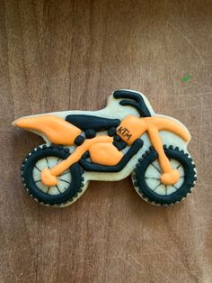 a decorated cookie shaped like a dirt bike