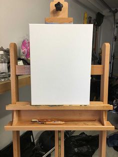 an easel with a blank canvas on it