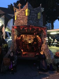 the back of a van decorated with halloween decorations