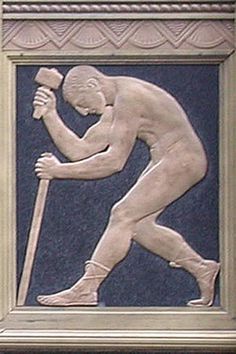 a statue of a man holding a baseball bat