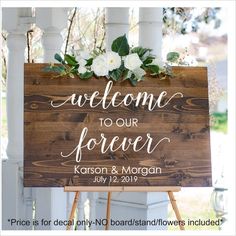 a wooden sign with white flowers on it that says welcome to our forever and mr and mrs