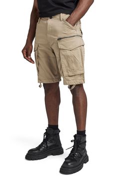 These stretch-cotton shorts feature large zip cargo pockets that add rugged and functional style you'll love for a day in the workshop or wilderness. 10" inseam; 22" leg opening; 12 3/4" front rise; 16 1/2" back rise (size 32) Zip fly with button closure Front slant pockets; side cargo pockets, back flap pockets 97% cotton, 3% elastane Machine wash, tumble dry Imported Short Utility Cargo Pants For Outdoor, Utility Cargo Shorts For Outdoor Activities, Utility Shorts For Outdoor, Outdoor Cargo Shorts With Belt Loops, Utility Shorts For Outdoor Activities, Khaki Hiking Shorts With Multiple Pockets, Outdoor Cotton Cargo Pants With Built-in Shorts, Utility Style Short Cargo Pants For Outdoor, Khaki Utility Cargo Shorts For Outdoor