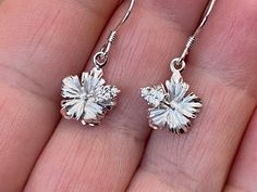 "Solid .925 Sterling Silver Hawaiian Hibiscus Flower Earrings. Purposely small & dainty at 8MM (just about 1/4\"). --They have a matte center w/ high-polished edges and accents. They also have tiny CZ's in the stem. The High-polished Sterling finish is stunning, durable and nickel-free. Lots of sparkle makes this a popular design in our Hawaii stores. --The Hibiscus is Hawaii's official State Flower. Hawaiian Hibiscus shrubs bear blooms almost every day but the blossoms last for only a day o Flower Shaped Pierced Jewelry For Anniversary, Sterling Silver Flower Earrings Fine Jewelry, Flower Shaped White Gold Earrings For Pierced Ears, Pierced White Gold Flower Earrings, White Gold Flower Shaped Pierced Earrings, White Gold Flower-shaped Pierced Earrings, Silver Flower Cluster Earrings In Sterling Silver, Sterling Silver Flower-shaped Cluster Earrings For Pierced Ears, Silver Sterling Silver Flower Cluster Earrings