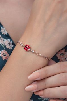 Ladybugs are often seen as symbols of good luck and happiness, and we wanted to capture that essence in this bracelet. The delicate details of the ladybug's wings and body make it a unique piece of jewelry that's perfect for any occasion. Whether you're looking for a special gift for someone you love or simply want to treat yourself to something beautiful, this ladybug bracelet is the perfect choice. It's made with high-quality materials and is designed to last, so you can wear it and cherish it for years to come. We put our heart and soul into every piece of jewelry we create, and this ladybug bracelet is no exception. We hope it brings you joy, happiness, and good luck wherever you go! Thank you for supporting our small business and allowing us to do what we love! Material: Silver ~ Colo Rose Gold Bracelets With Lobster Clasp As A Gift, Rose Gold Bracelets With Lobster Clasp For Gift, Ladybug Bracelet, Snowflake Bracelet, Spring Bracelet, Bracelet Rose Gold, Winter Jewelry, Kids Bracelets, Jewelry Dainty