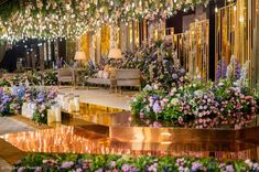 a room filled with lots of flowers and lights