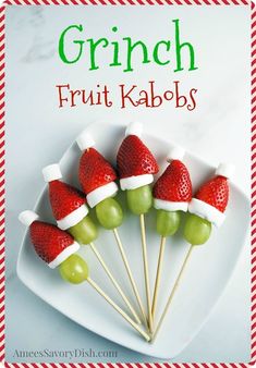 the cover of grin fruit kabobs on a plate with strawberries and grapes