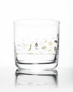 a clear glass bowl sitting on top of a table