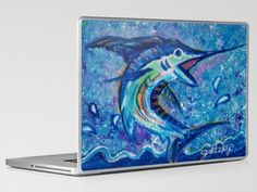 a painting of a marlin fish on a laptop